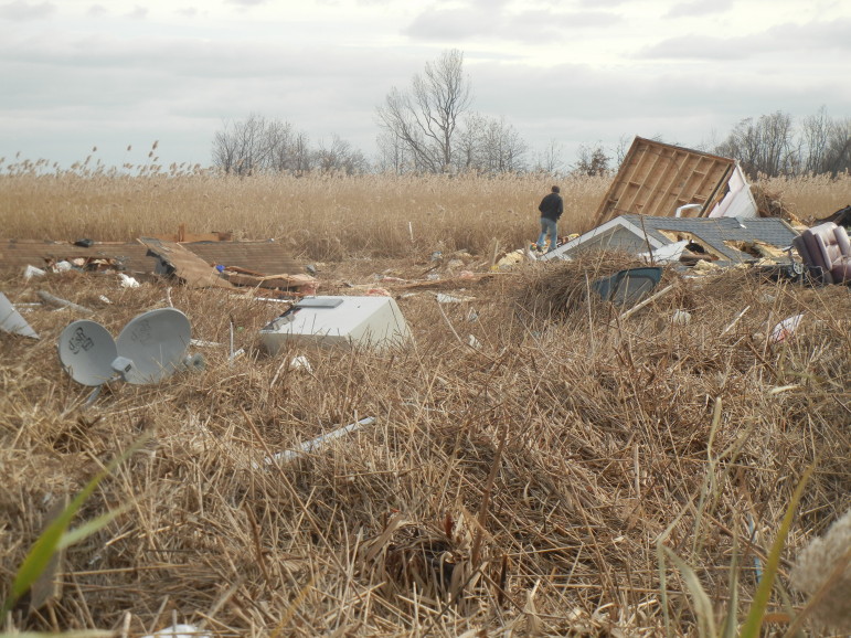 This marsh in the Oakwood Beach area of Staten Island became the final resting place for roofs, appliances and clothes.