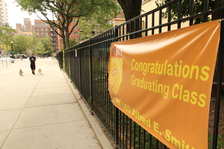 A banner welcomes the end of the school year at P.S. 163 on Manhattan's Upper West Side. Though most classes are done there and at other DOE facilities, the issues facing New York's educators, parents and students do not take a summer break.