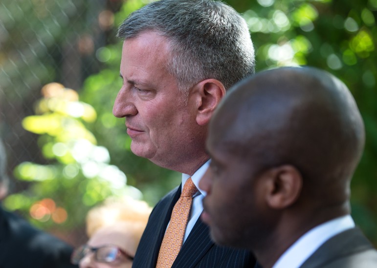 The mayor with outgoing DHS head Gilbert Taylor at an event in September.