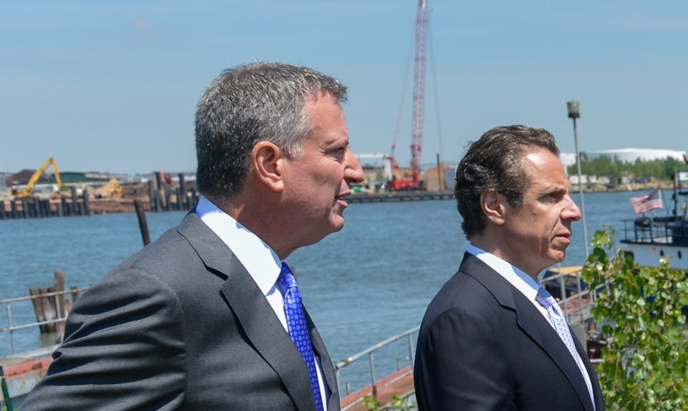 The mayor and governor seen at a 2014 event. De Blasio has offered to go solo on supportive housing, but advocates say the state's help is needed if the program is to achieve the necessary scale.