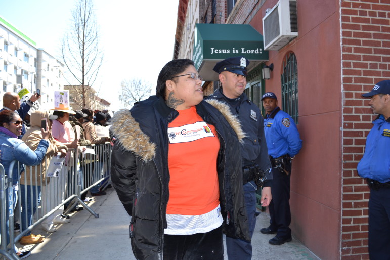 Local advocate Rachel Rivera gets arrested outside Councilman Espinal's offices on Wednesday.