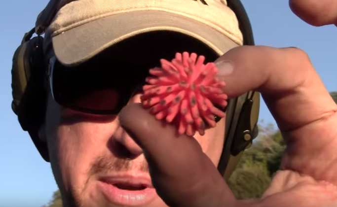 A YouTube host displays one of the Star-Lite rounds manufactured by Lightfield Ammunition. 
