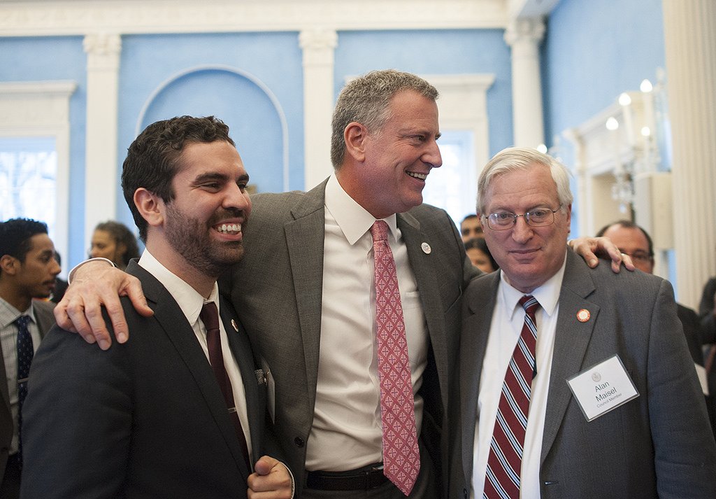 Councilmembers Rafael Espinal and Alan Maisel, seen embracing Mayor de Blasio, are among two former state legislators who left Brooklyn seats vacant when they won municipal office last fall. A fifth seat was made vacant by a corruption conviction.