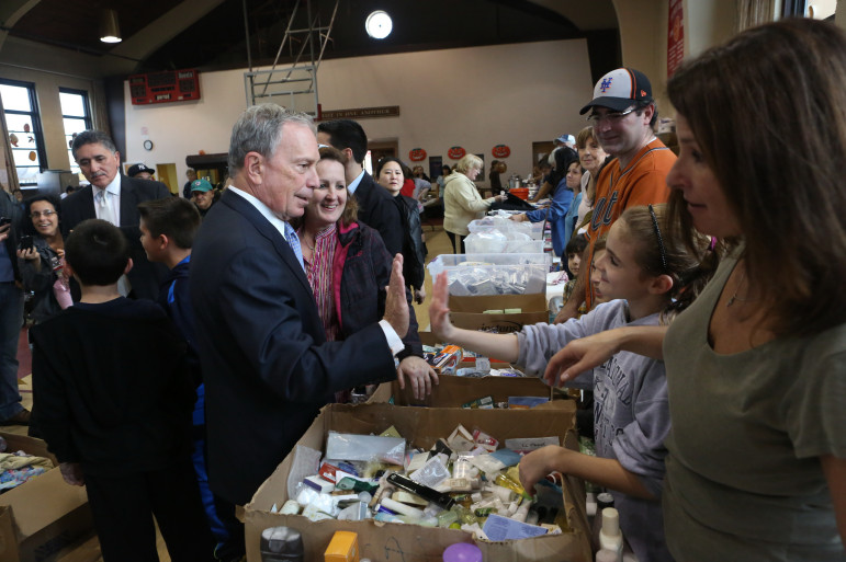 Mayor Bloomberg visits a food distribution center in Howard Beach in 2012 after superstorm Sandy. Food stamp usage in the city soared during the first 11 years of his tenure, then began a decline last year that has continued.