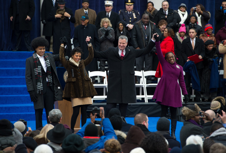 New York City Mayor Bill de Blasio and his wife Chirlane McCray and children Dante and Chiara wave to the crowd after the mayor took the oath of office. It was the beginning of a tumultuous 12 months for de Blasio, his progressive agenda and the city itself.