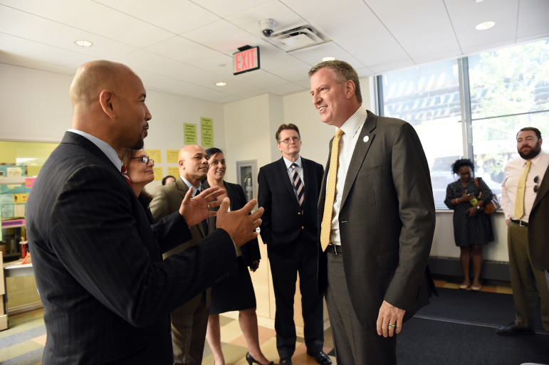 Bronx Borough President Ruben Diaz Jr. talks with Mayor de Blasio in this file photo. According to Diaz, there's disagreement about what shape the mayor's housing plan should take in the Bronx—and Diaz's view is the right one.
