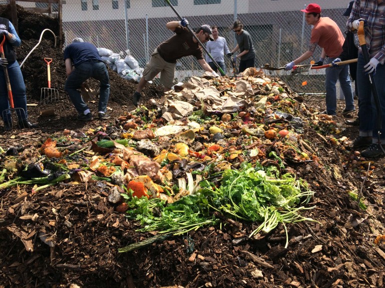 Members of the Gowanus Canal Conservancy work on a windrow during their monthly compost build. Their site is one of more than 200 around the city already involved in reusing food waste that otherwise would be trucked to a landfill.