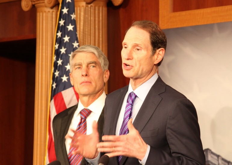Oregon Sen. Ron Wyden (seen with then-Senator Marc Udall of Colorado at an unrelated press conference) has proposed allowing states to spend more child-welfare money on preventive services.