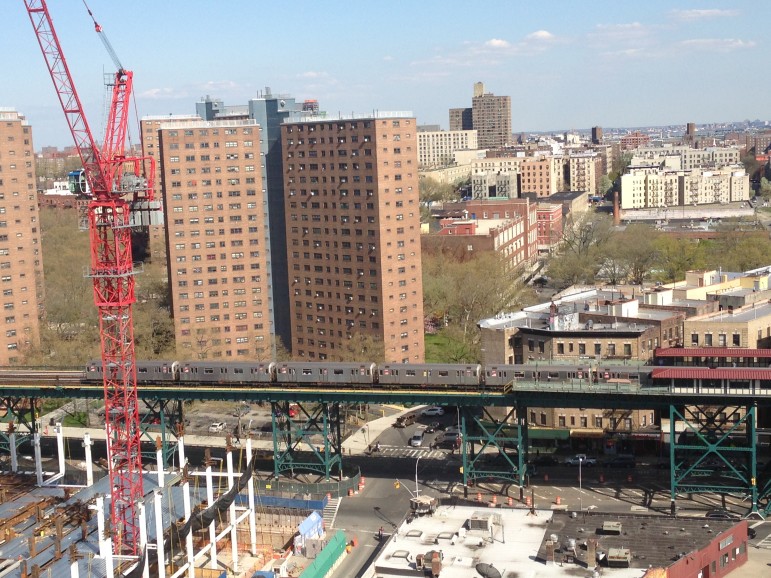 Columbia's new campus rises in the foreground. The Manhattanville Houses are just beyond the elevated 1 train.
