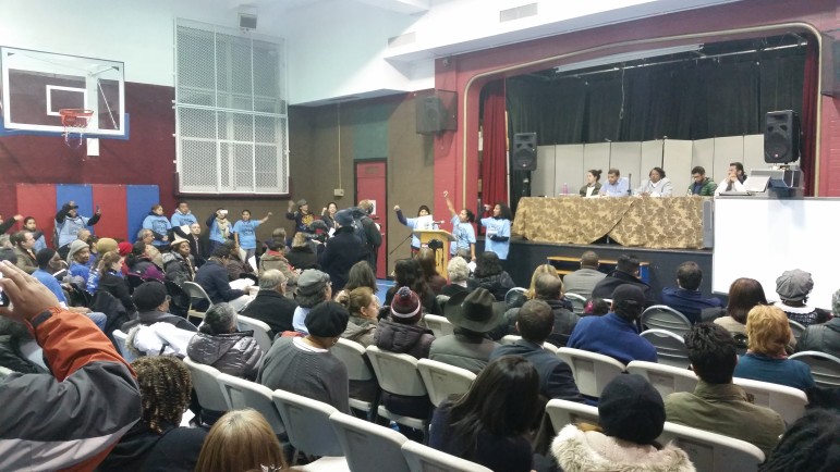 Members of Movement for Justice in El Barrio speak against the mayor's proposals at the CB11 meeting.