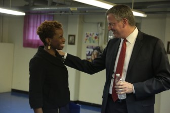 Current NYCHA chairwoman Shola Olatoye and Mayor de Blasio. She's been credited with doing more to engage residents in her own infill proposal, but resistance remains.