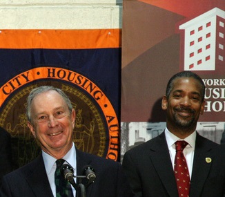 Mayor Bloomberg and John Rhea at a press conference in 2010. Rhea took the heat for maintenance problems and other woes at NYCHA.