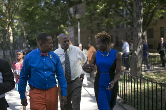 Bronx Councilmember Andrew King tours a NYCHA development with authority chairwoman Shola Olatoye.