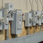 a row of utility meters on a wall