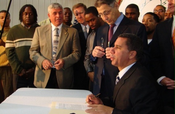 Gov. David Paterson signs the Green Jobs/Green New York Act in the fall of 2009.
