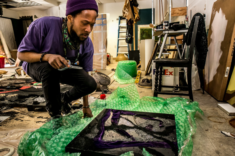 During an afternoon in late February, artist Brandon Coley Cox preparing to to pack his painting titled "Windows for Thornton" for an exhibition at Volta art fair in Manhattan. Mr. Cox has his studio at the Restoration Plaza in the Bedford-Stuyvesant section of Brooklyn, New York.