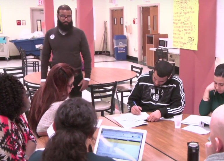 Teachers meet daily at West Brooklyn to discuss each student's progress.
