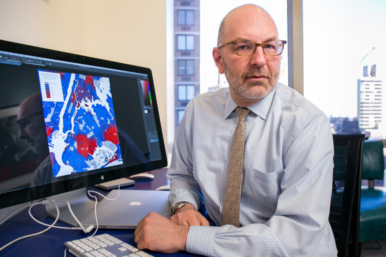 Attorney Craig Gurian at his office in Manhattan. His computer shows a map of racial concentration in New York City neighborhoods.