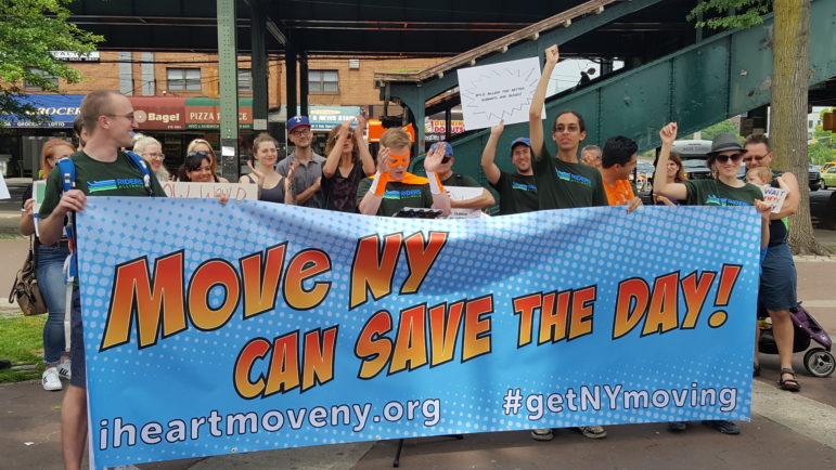 Supporters of the plan, which would raise some tolls while lowering others and use the revenue to fix roads and mass transit, at an early June rally.