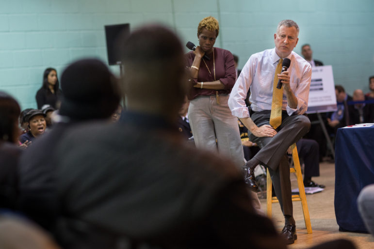 Mayor Bill de Blasio and NYCHA Chair Shola Olatoye seen in January at a forum at the Wycoff Houses in Brooklyn. The authority says the private-sector partnerships it has embraced under Olatoye shore up finances and improve services to residents.