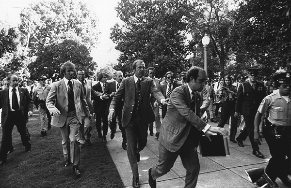 President Ford is rushed from the scene of one of two assassination attempts against him in 1975.