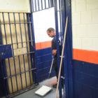 A staffer paints a cell at Rikers Island jail