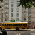 On Friday, two school buses arrived to relocate migrant families staying at an emergency shelter hotel in Queens. Most families resisted the move.